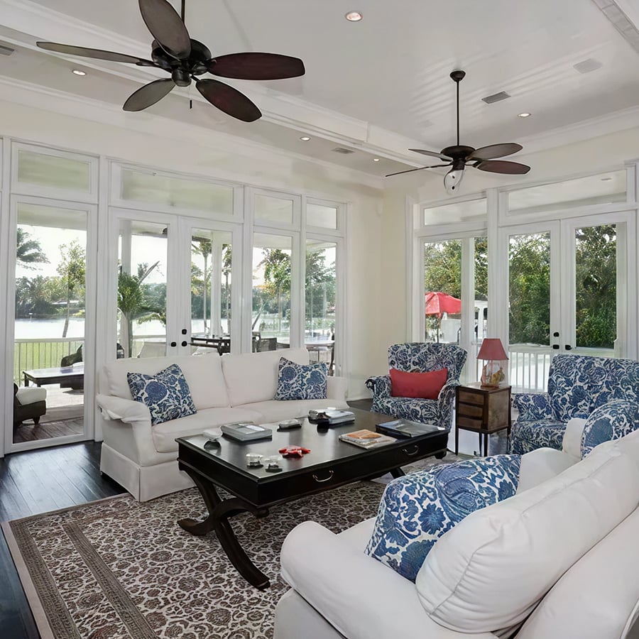 Outdoor covered patio with ceiling fan and comfortable seating